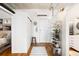 Bright entryway with hardwood floors and decorative shelving, adjacent to the bedroom at 2261 Blake St # 2G, Denver, CO 80205