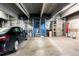 Secured garage space with car and storage units at 2261 Blake St # 2G, Denver, CO 80205