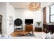 Bright living room with modern lighting, white walls, and hardwood floors, creating an inviting and stylish space at 2261 Blake St # 2G, Denver, CO 80205