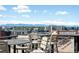 Rooftop deck boasting panoramic city views and a spot for outdoor dining at 2261 Blake St # 2G, Denver, CO 80205