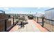 Spacious rooftop deck area with outdoor seating and city views at 2261 Blake St # 2G, Denver, CO 80205