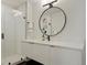 Modern bathroom with walk-in shower, sleek vanity, and circular mirror at 2120 N Downing St # 209, Denver, CO 80205