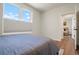 Bright bedroom features a large window and leads to another room at 2120 N Downing St # 209, Denver, CO 80205