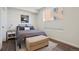 Comfortable bedroom featuring a large window, modern decor, and a cozy atmosphere, creating a relaxing space at 2120 N Downing St # 209, Denver, CO 80205