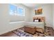 Cozy bedroom with decorative rug and natural-light window at 2120 N Downing St # 209, Denver, CO 80205