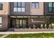 Modern building facade with clean landscaping and clear signage at 2120 N Downing St # 209, Denver, CO 80205