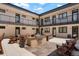 Inviting courtyard with a grill, picnic table, and Adirondack chairs for relaxing and entertaining at 2120 N Downing St # 209, Denver, CO 80205