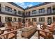 Inviting outdoor courtyard with fire pit, seating, and communal grilling area at 2120 N Downing St # 209, Denver, CO 80205