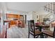 Open concept kitchen, dining area with island, wood cabinets, granite countertops and stainless steel appliances at 12974 W Virginia Ave, Lakewood, CO 80228