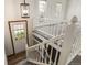 Entryway featuring white stairs, a modern light fixture, and a door with a window leading outside at 11182 W 103Rd Cir, Broomfield, CO 80021