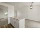Bright kitchen with an island featuring a stone countertop and stainless steel accents and fixtures at 11182 W 103Rd Cir, Broomfield, CO 80021