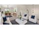 Bright, open-concept living space with white furnishings flowing into dining area and kitchen at 11182 W 103Rd Cir, Broomfield, CO 80021
