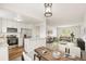 Inviting open-concept layout with modern kitchen and dining area seamlessly connected to the living room at 11182 W 103Rd Cir, Broomfield, CO 80021
