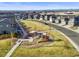 An aerial view shows a community park with playground and green space surrounded by homes at 2754 W 69Th Ave, Denver, CO 80221