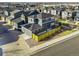 Aerial view of neighborhood homes with solar panels and fenced in yard at 2754 W 69Th Ave, Denver, CO 80221