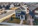 Beautiful two-story home with a well-maintained lawn, solar panels and a welcoming front porch at 2754 W 69Th Ave, Denver, CO 80221