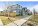 View of neighborhood homes showing sidewalks and shared lawn in a well kept area at 2754 W 69Th Ave, Denver, CO 80221