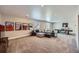 Finished basement with a large sectional sofa, ping pong table, and movie posters at 4689 Coltin Trl, Castle Rock, CO 80104