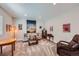 Basement area featuring carpeted floors, a sofa, artwork, and a table with record player at 4689 Coltin Trl, Castle Rock, CO 80104