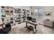 Bright home office with built-in shelving and a comfortable workspace at 4689 Coltin Trl, Castle Rock, CO 80104