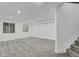 Large, finished basement with carpet, recessed lighting, and staircase at 1894 S Marshall Cir, Lakewood, CO 80232