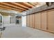 Unfinished basement offers ample storage with exposed beams and framework at 1894 S Marshall Cir, Lakewood, CO 80232