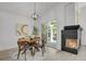 Bright dining area with modern lighting, fireplace and access to the outdoor patio at 1894 S Marshall Cir, Lakewood, CO 80232