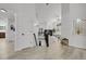 Bright foyer leading to the open-concept living area with hardwood floors and modern finishes at 1894 S Marshall Cir, Lakewood, CO 80232