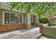 Inviting front porch with brick accents offering a welcoming entrance to the home at 1894 S Marshall Cir, Lakewood, CO 80232