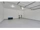 Spacious garage with epoxy flooring and ample room for storage and vehicles at 1894 S Marshall Cir, Lakewood, CO 80232