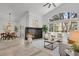 Open living area with fireplace, access to the dining and large windows at 1894 S Marshall Cir, Lakewood, CO 80232