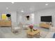 A spacious living room with neutral tones, stylish furnishings, and recessed lighting offers a cozy atmosphere at 1894 S Marshall Cir, Lakewood, CO 80232