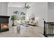 Spacious living room with a cozy fireplace, large windows, and stylish decor at 1894 S Marshall Cir, Lakewood, CO 80232