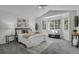 Spacious main bedroom suite with bright windows, plush carpeting, and cozy seating at 1894 S Marshall Cir, Lakewood, CO 80232