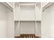 Walk-in closet featuring clean white walls and shelving at 19060 E 54Th Pl, Denver, CO 80249