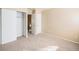 Cozy bedroom featuring plush carpet, closet, neutral paint, and white trim at 8901 Field St # 81, Broomfield, CO 80021