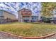 View of the spacious backyard with a patio, deck, fire pit and well maintained yard at 9662 Newcastle Dr, Highlands Ranch, CO 80130