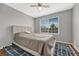 Cozy bedroom features a comfortable bed, soft rug, and a large window, creating a relaxing space at 9662 Newcastle Dr, Highlands Ranch, CO 80130