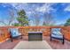 Inviting deck with cozy seating and a modern fire pit perfect for outdoor relaxation and entertainment at 9662 Newcastle Dr, Highlands Ranch, CO 80130