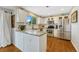 Bright kitchen features stainless steel appliances and granite countertops at 9662 Newcastle Dr, Highlands Ranch, CO 80130