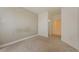 Neutral bedroom featuring carpet flooring, ensuite access, and light walls at 3500 S Corona St # 206, Englewood, CO 80113