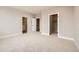 Large bedroom with plush carpet and walk-in closet at 780 Josephine Way, Superior, CO 80027