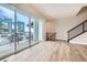 Bright living room with hardwood floors and sliding glass door to deck at 780 Josephine Way, Superior, CO 80027