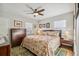 Main bedroom with a ceiling fan, double closets, and plenty of natural light at 2895 Dexter St, Denver, CO 80207