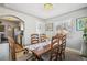 Spacious dining area with a wooden table and access to the kitchen at 2895 Dexter St, Denver, CO 80207