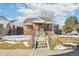 Brick ranch home with a covered porch and steps leading to the front entrance at 2895 Dexter St, Denver, CO 80207