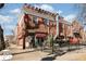 Brick building with restaurant on ground floor at 2895 Dexter St, Denver, CO 80207