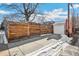 Detached garage with wood fence and snow at 2895 Dexter St, Denver, CO 80207