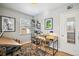 Bright home office features built-in shelving and a large desk at 2895 Dexter St, Denver, CO 80207