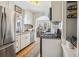 Kitchen with stainless steel appliances, white cabinets and granite countertops at 2895 Dexter St, Denver, CO 80207